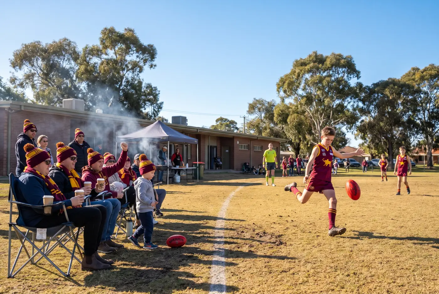 Match day at the reserve with families on the boundary